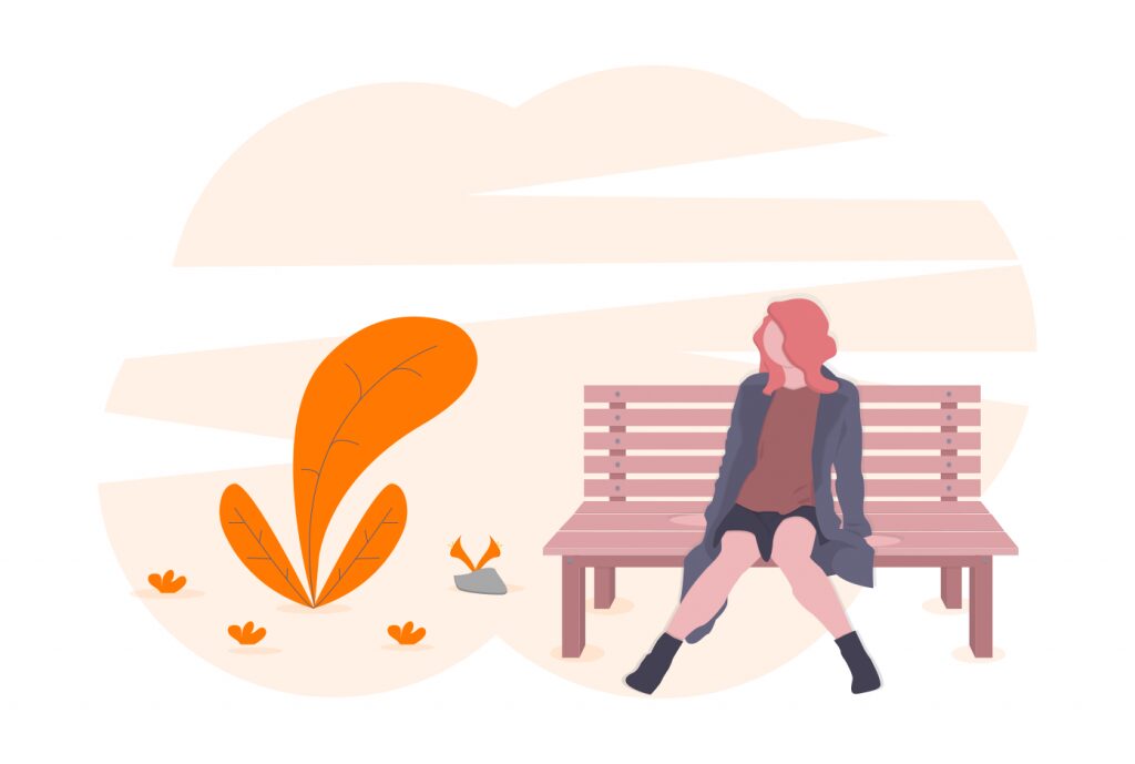 woman sitting on a bench outdoors